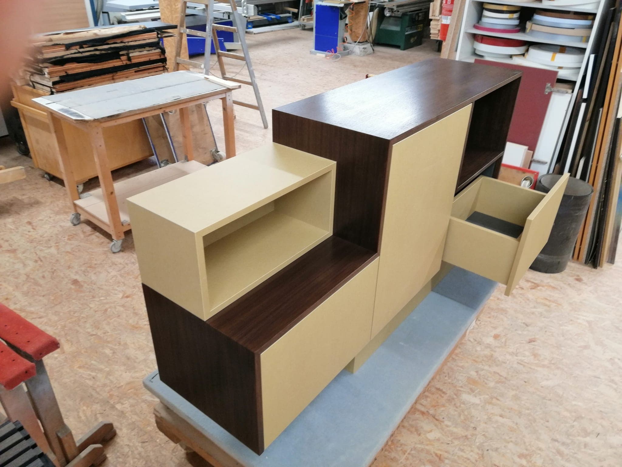 Stereo sideboard from the side with a pulled-out drawer and custom inserts