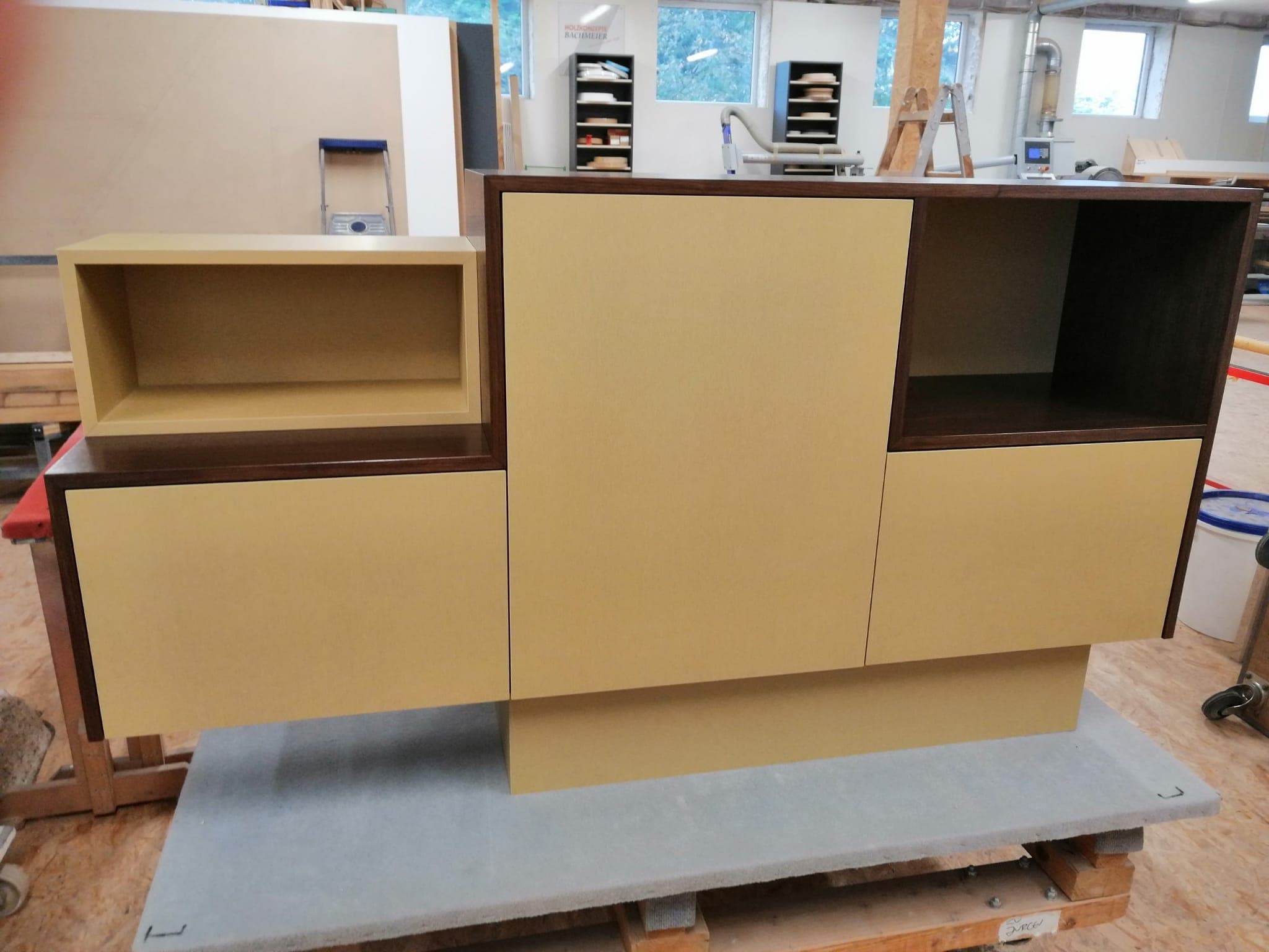 Stereo sideboard with mustard fronts and a dark wenge frame