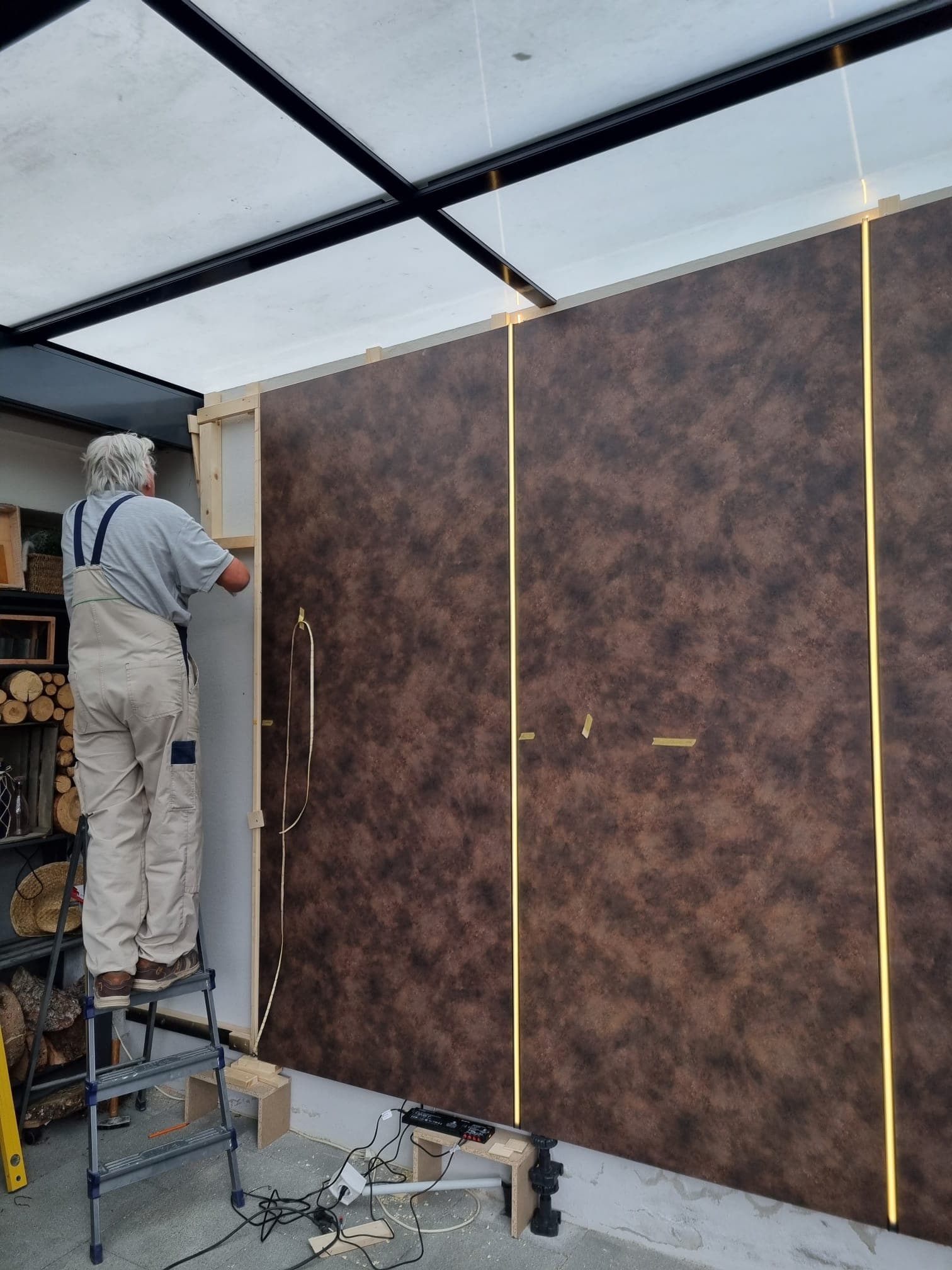 Installation of the wall panels with LED strips in the conservatory